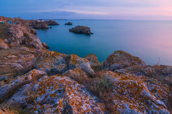 sunset kayak adventure rocky coast ocean twilight